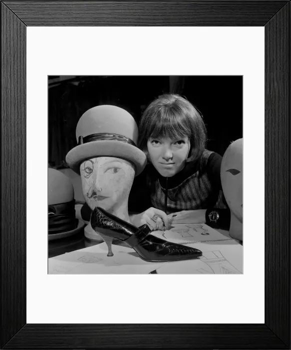 Framed Print : Mary Quant, clothes designer, standing inside her shop Bazaar with examples of the shoes Framed Print : Mary Quant, clothes designer, standing inside her shop Bazaar with examples of the shoes