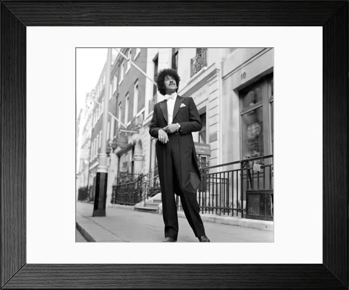 Framed Print : Phil Lynott of Thin Lizzy modelling clothes from Saville Row, London Framed Print : Phil Lynott of Thin Lizzy modelling clothes from Saville Row, London