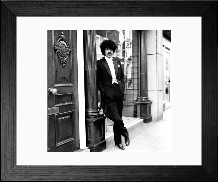 Framed Print : Phil Lynott of Thin Lizzy modelling clothes from Saville Row, London Framed Print : Phil Lynott of Thin Lizzy modelling clothes from Saville Row, London