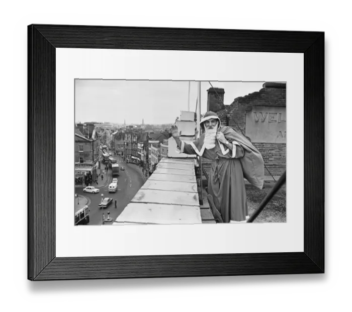 Framed Print : Father Christmas seen here on the roof of Wellsteed department store in Broad Street Framed Print : Father Christmas seen here on the roof of Wellsteed department store in Broad Street