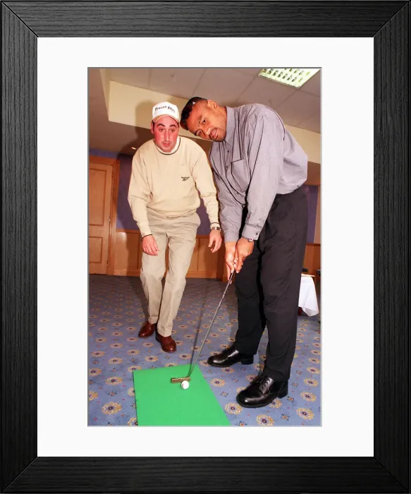 Framed Print : Jonah Lomu Rugby player October 1999 playing golf putting Receiving lesson from Kevin