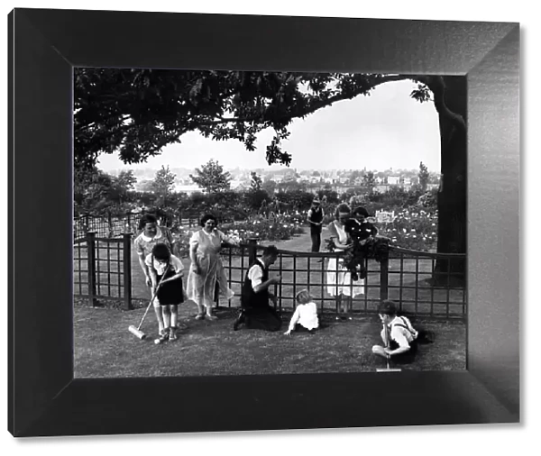 A mother and her four children evacuated from Kirkdale, enjoy themselves in the gardens