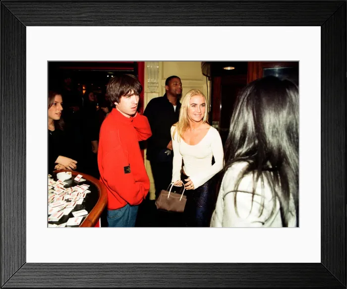 Framed Print : Noel Gallagher, from the pop / rock group Oasis, and his girlfriend Meg Matthews seen at an Framed Print : Noel Gallagher, from the pop / rock group Oasis, and his girlfriend Meg Matthews seen at an