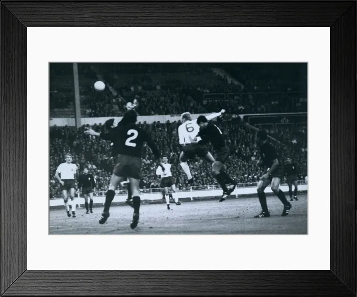 Framed Print : Bobby Moore heads the ball towards the Mexican goal during Englands match against Mexico Framed Print : Bobby Moore heads the ball towards the Mexican goal during Englands match against Mexico