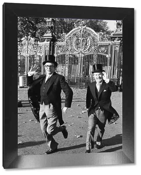 Morecambe and Wise seen here outside the gates of Buckingham Palace doing their