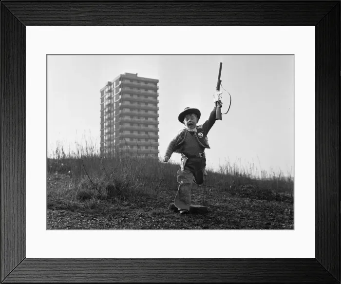 Framed Print : Young boy playing cowboys in Collyhurst, Manchester 14th January 1968 His Framed Print : Young boy playing cowboys in Collyhurst, Manchester 14th January 1968 His