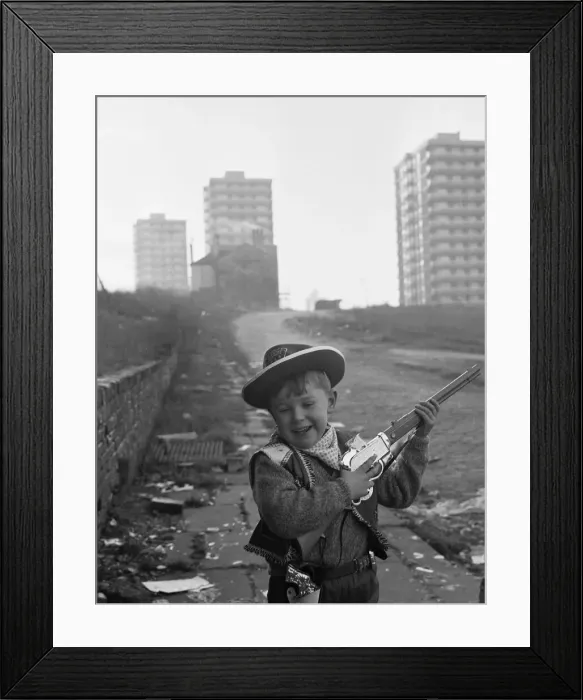 Framed Print : Young boy playing cowboys in Collyhurst, Manchester 14th January 1968 His Framed Print : Young boy playing cowboys in Collyhurst, Manchester 14th January 1968 His