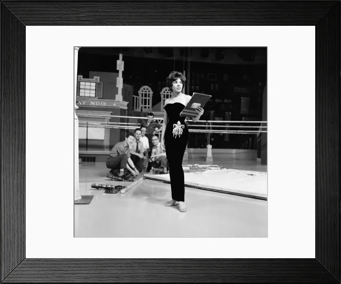 Framed Print : Shirley Bassey wearing the hip-hugging black velvet dress that she says catches mens