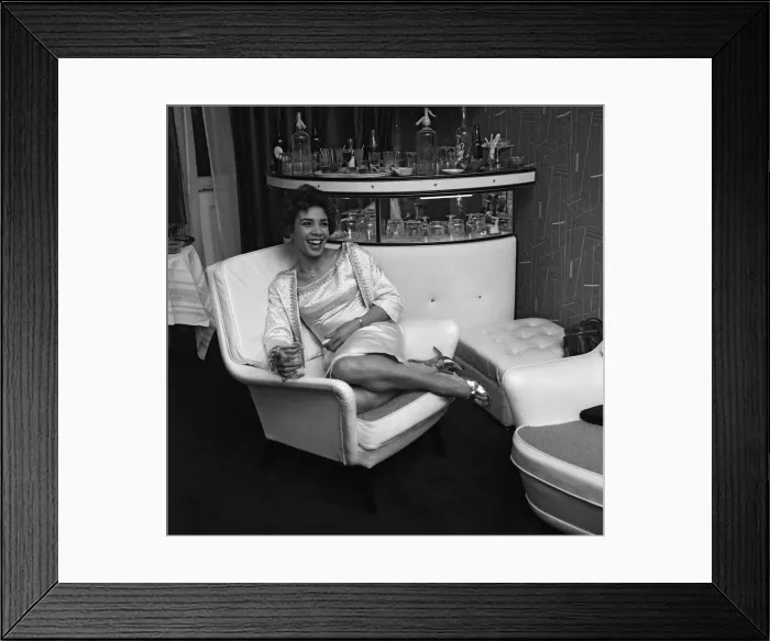Framed Print : Shirley Bassey in her new house in central London, where she held a house warming party Framed Print : Shirley Bassey in her new house in central London, where she held a house warming party