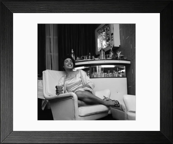 Framed Print : Shirley Bassey in her new house in central London, where she held a house warming party Framed Print : Shirley Bassey in her new house in central London, where she held a house warming party