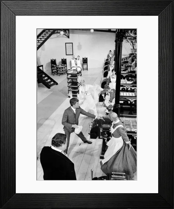 Framed Print : Dick Van Dyke and Sally Ann Howes (behind)) filming a scene for Chitty Chitty Bang Bang