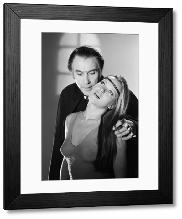 Framed Print : Christopher Lee, being photographed for poster, dressed as character Dracula in film