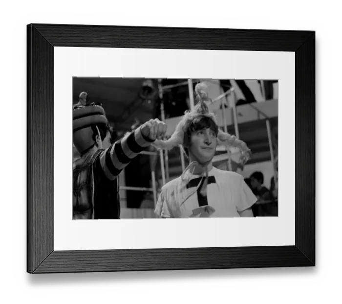 Framed Print : John Lennon from The Beatles rehearsing for the filming of