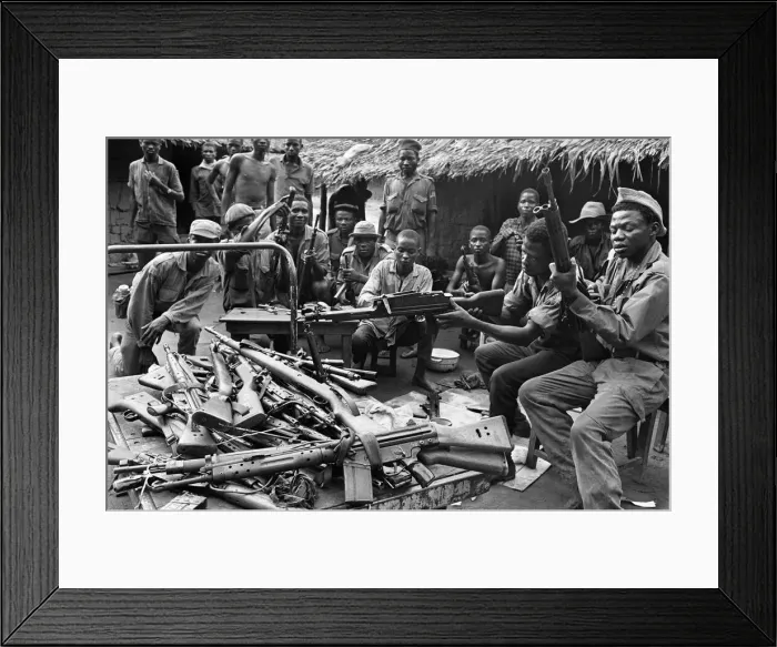 Framed Print : Biafran soldiers seen here testing out a large stockpile of weapons during the conflict Framed Print : Biafran soldiers seen here testing out a large stockpile of weapons during the conflict