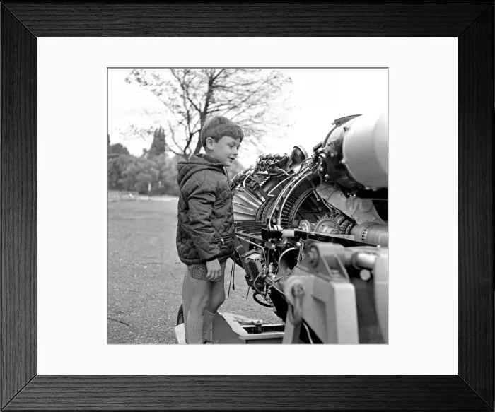 Framed Print : A young boy (unidentified) enjoys inspecting an engine at the RAF Display at Caversham Framed Print : A young boy (unidentified) enjoys inspecting an engine at the RAF Display at Caversham