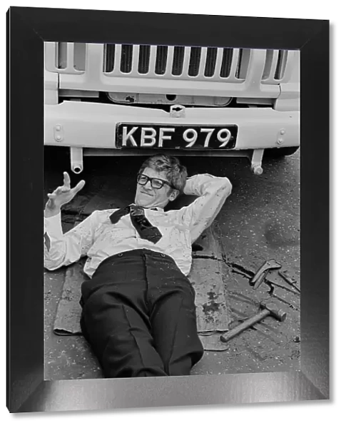 Peter Gilmore, on the floor, on the film set of Carry On Doctor