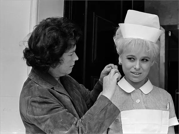 Barbara Windsor (right) having her hair sorted on the film set of Carry On Doctor
