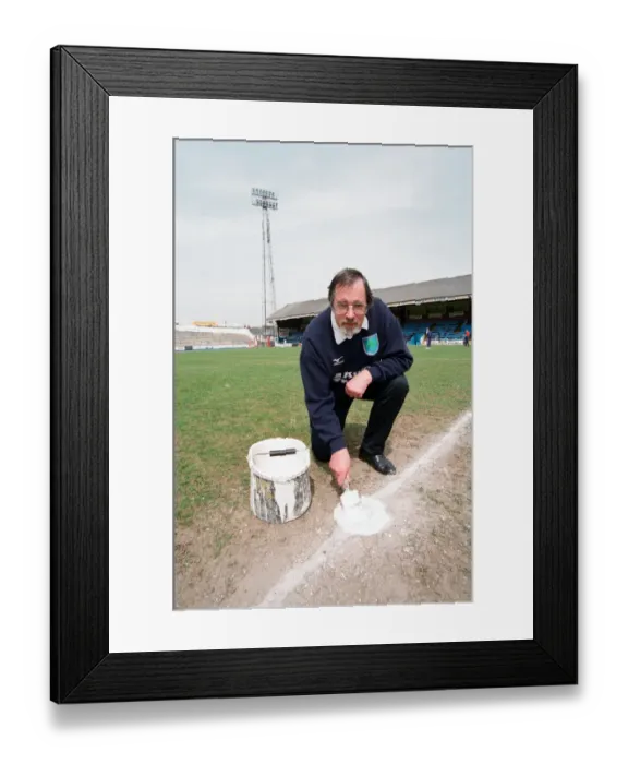 Framed Print : David Downs marks the pitch at Elm Park. Reading, 8th May 1998