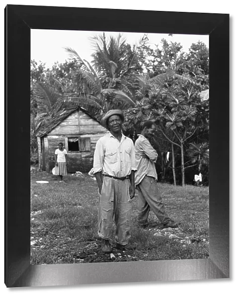 Jamaican Maroons pose for the camera outside their house in St Elizabeth