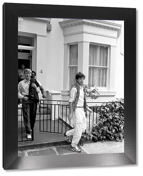 David Bowie and Mick Jagger in London. Mick Jagger getting into the car