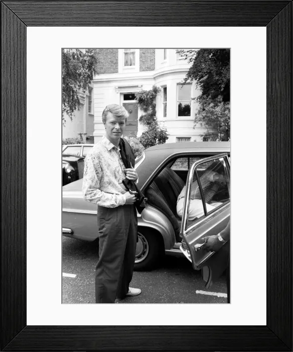 Framed Print : David Bowie and Mick Jagger in London, Mick Jagger getting into the car Framed Print : David Bowie and Mick Jagger in London, Mick Jagger getting into the car