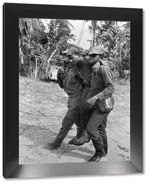 Biafran soldiers seen here carrying an injured comrade during the Biafra conflict