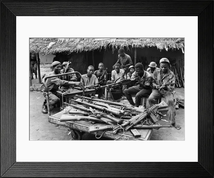 Framed Print : Biafran soldiers seen here testing out a large stockpile of weapons during the conflict Framed Print : Biafran soldiers seen here testing out a large stockpile of weapons during the conflict