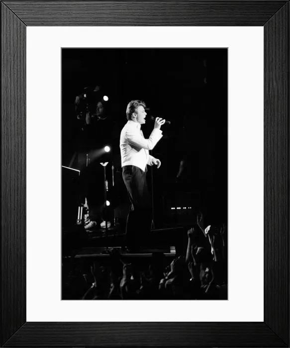 Framed Print : David Bowie on stage at the Birmingham NEC. The concert is part of Framed Print : David Bowie on stage at the Birmingham NEC. The concert is part of