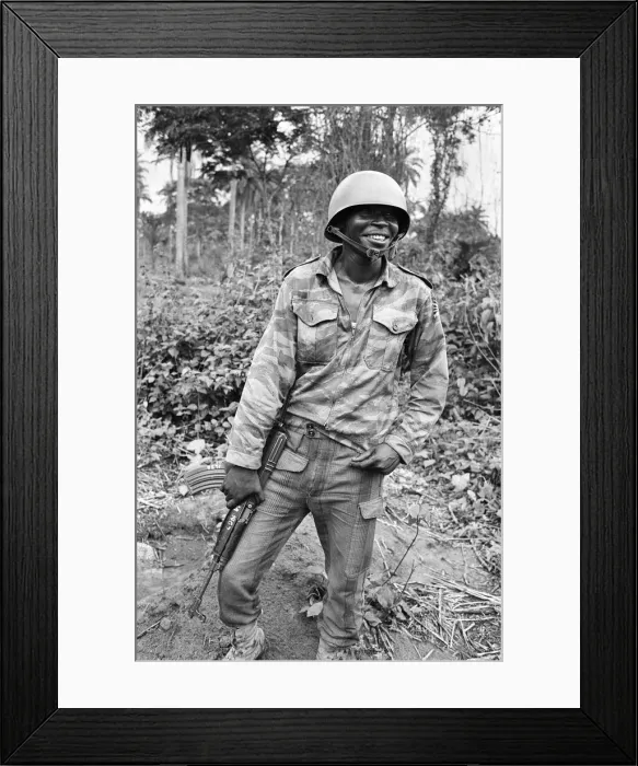 Framed Print : A Biafran soldier seen here in relaxed mood, armed with an AK47 semi automatic rifle Framed Print : A Biafran soldier seen here in relaxed mood, armed with an AK47 semi automatic rifle