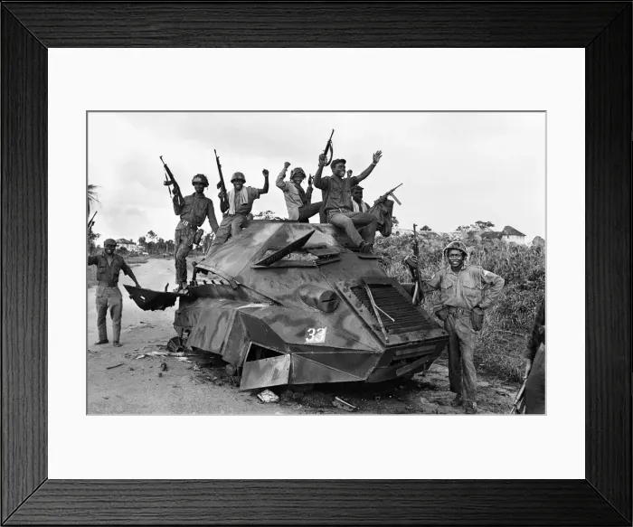 Framed Print : Joyous Biafran soldiers seen here cheering with guns in the air as they sit atop a