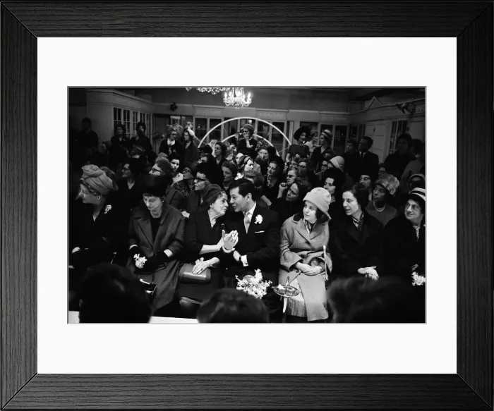 Framed Print : Four hours after getting married this morning, 24-year-old Judy Wilson went back to work