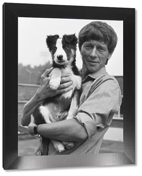 Blue Peter presenter John Noakes, seen here with the programmes new border collie puppy