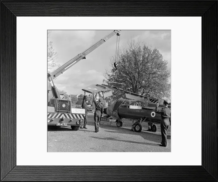 Framed Print : The wings being attached to a Folland Gnat of the Red Arrows in preparation for a Royal
