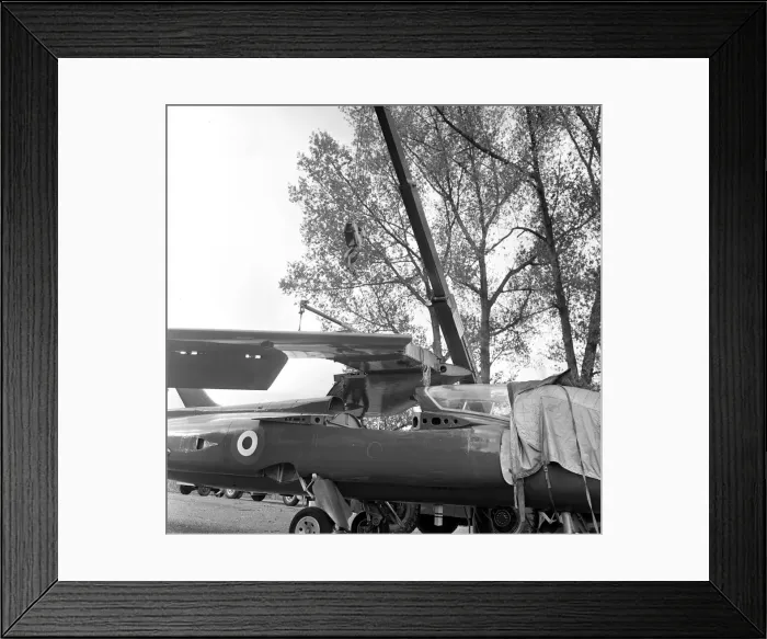 Framed Print : The wings being attached to a Folland Gnat of the Red Arrows in preparation for a Royal Framed Print : The wings being attached to a Folland Gnat of the Red Arrows in preparation for a Royal