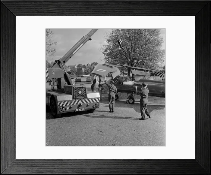 Framed Print : The wings being attached to a Folland Gnat of the Red Arrows in preparation for a Royal Framed Print : The wings being attached to a Folland Gnat of the Red Arrows in preparation for a Royal