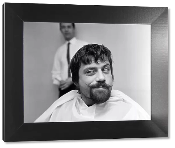 Actor, Oliver Reed, had to make a decision whether to keep his beard or to keep