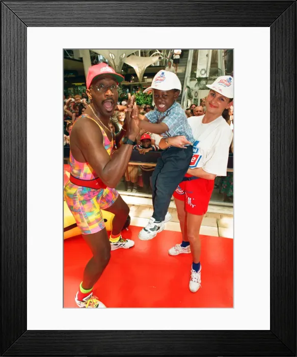Framed Print : Mr Motivator aka Derrick Evans at Broad Street Mall, Reading. 25th June 1996 Framed Print : Mr Motivator aka Derrick Evans at Broad Street Mall, Reading. 25th June 1996