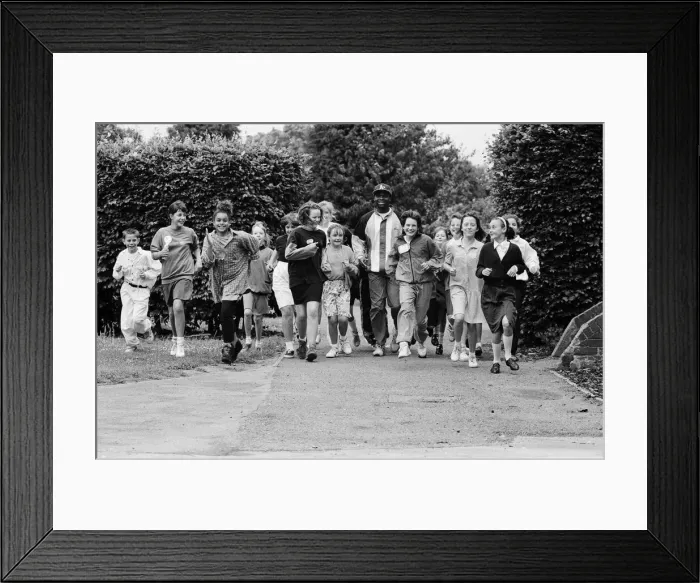 Framed Print : Kriss Akabusi at Geoffrey Field School, Reading. 8th July 1991 Framed Print : Kriss Akabusi at Geoffrey Field School, Reading. 8th July 1991