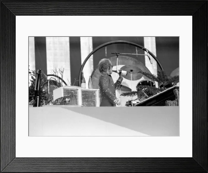 Framed Print : Elton John performing on stage at Wembley Stadium. London Framed Print : Elton John performing on stage at Wembley Stadium. London