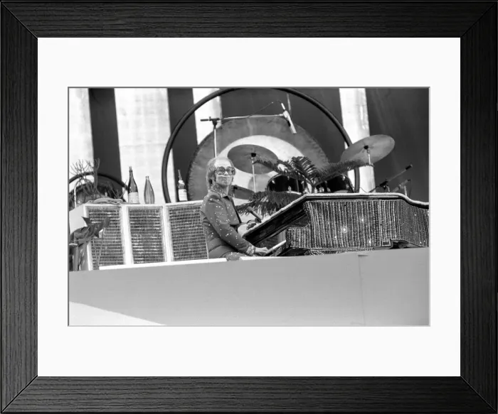 Framed Print : Elton John performing on stage at Wembley Stadium. London Framed Print : Elton John performing on stage at Wembley Stadium. London