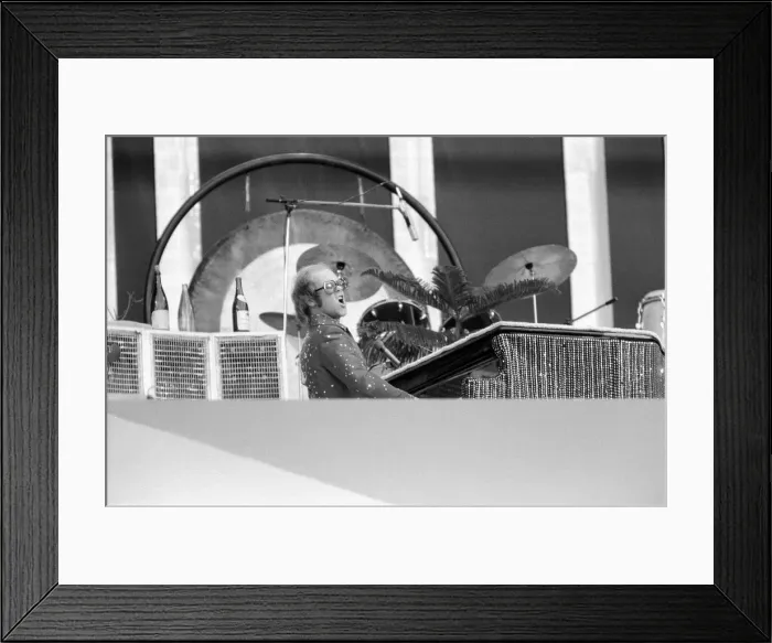 Framed Print : Elton John performing on stage at Wembley Stadium. London Framed Print : Elton John performing on stage at Wembley Stadium. London