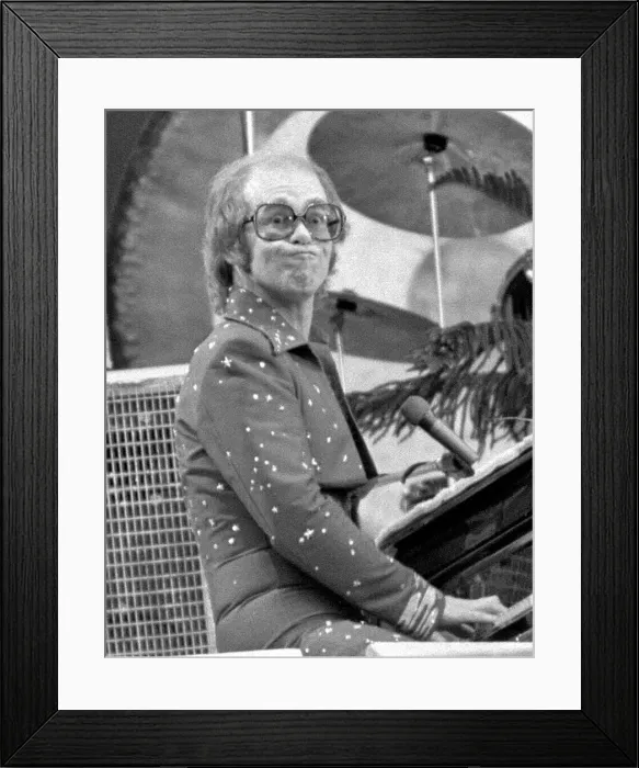 Framed Print : Elton John performing on stage at Wembley Stadium. London, England Framed Print : Elton John performing on stage at Wembley Stadium. London, England