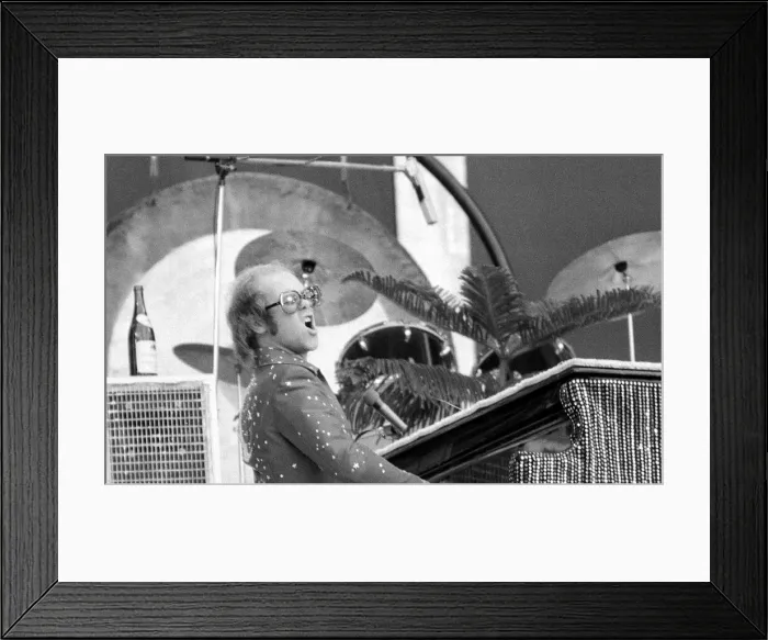 Framed Print : Elton John performing on stage at Wembley Stadium. London, England Framed Print : Elton John performing on stage at Wembley Stadium. London, England