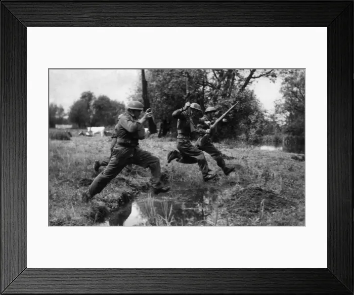 Framed Print : Members of the Reading Home Guard jumping ditches on the blitz course