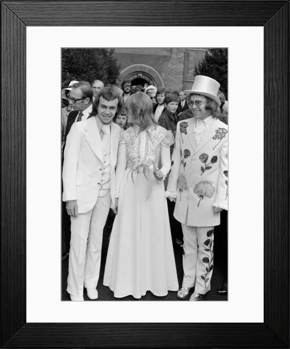 Framed Print : Elton John (right) pictured here as best man to his songwriting partner Bernie Taupin Framed Print : Elton John (right) pictured here as best man to his songwriting partner Bernie Taupin