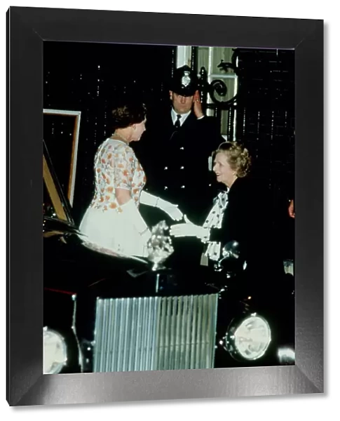 Mrs Margaret Thatcher greets Queen Elizabeth II on her arrival at 10 Downing Street to