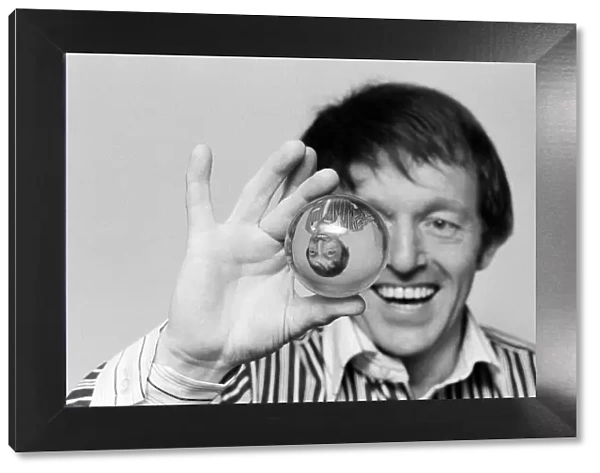 Magician Paul Daniels with a crystal ball. 1st February 1978