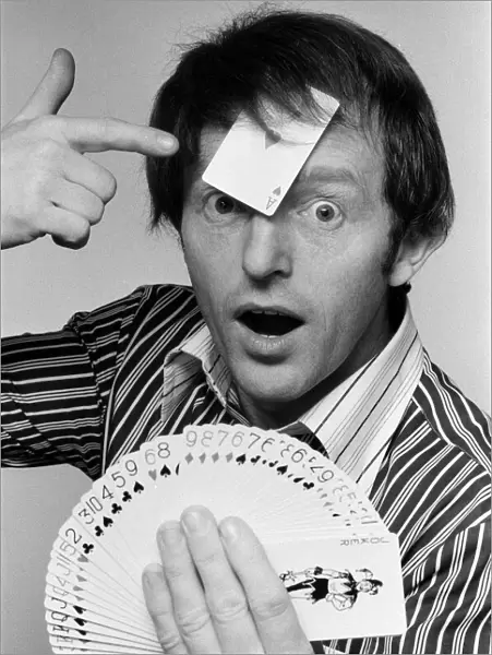 Magician Paul Daniels demonstrates a card trick. 1st February 1978