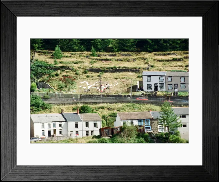 Framed Print : A huge Dragon made from recycled marble on the hillside in Blaenllechau Framed Print : A huge Dragon made from recycled marble on the hillside in Blaenllechau