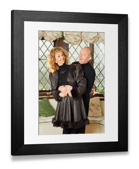 Framed Print : Magician Paul Daniels and his wife Debbie McGee pictured at home. 13th December 1991